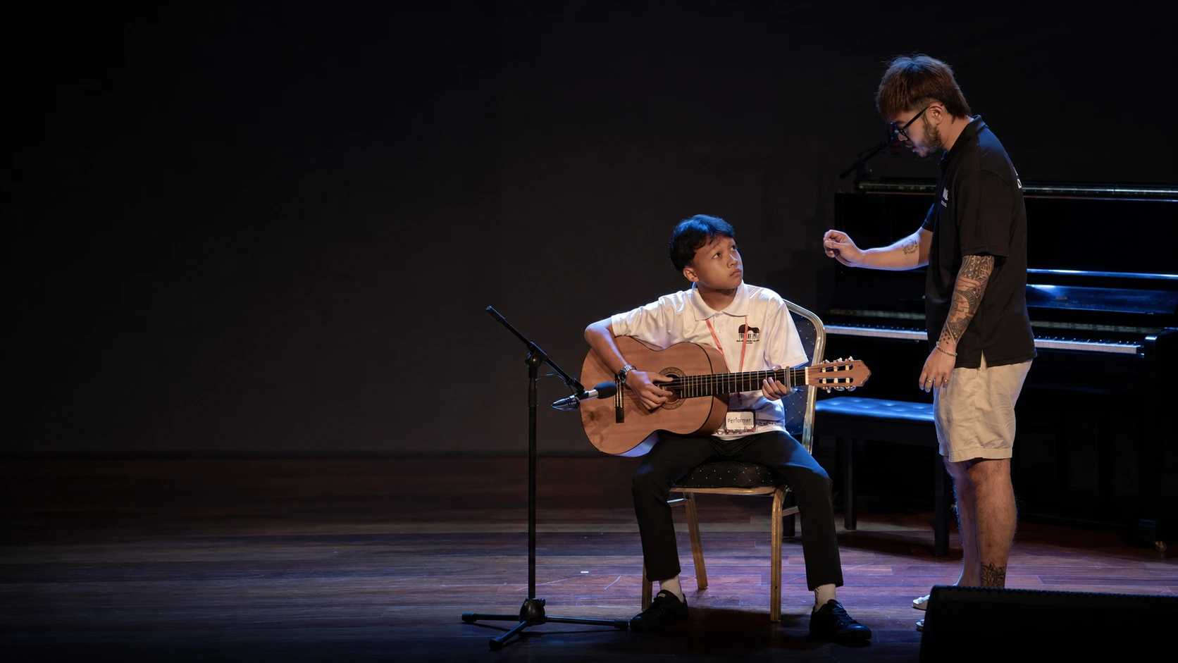 Guitar learning moment at Helen's Music Centre