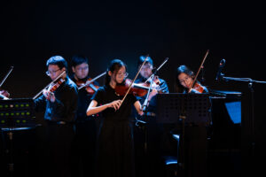 Violin learning moment at Helen's Music Centre